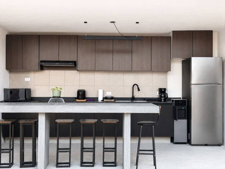 Full-sized fridge, microwave, stovetop, cookware/dishes/utensils