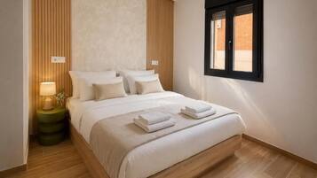 Family Apartment | Down comforters, individually decorated, individually furnished
