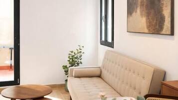 Deluxe Studio | Living area | 32-inch flat-screen TV with digital channels