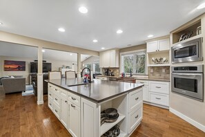 Fridge, microwave, oven, stovetop - Experience coastal comfort at Tolovana Footprints, a spacious 4-bedroom home in Cannon Beach. (Cannon Beach)
