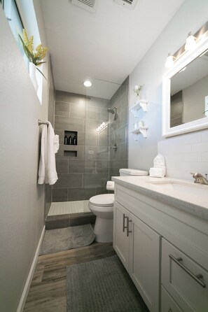 Shower, hair dryer, towels, soap