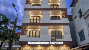 A multi-story building with a sign reading 'Danang Boutique Apartment.' - Danang Boutique Apartment | 02 Private Balcony 5 min to the Beach (Đà Nẵng)