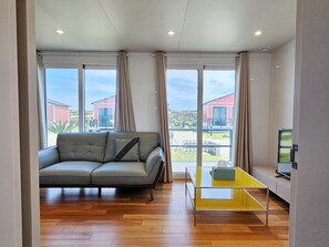 12-pyeong couple room with terrace | Living area | 50-inch flat-screen TV with cable channels