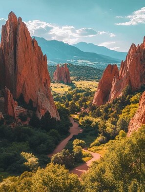 A valley with red rock formations and a river. - Woodland Park Home with Direct Views of Pikes Peak! (Woodland Park)