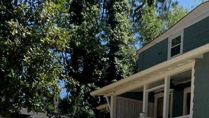 A swimming pool with lounge chairs and a wooden deck. - Pristine Craftsman 1900s Bungalow w Pool & Hot Tub (Savannah)