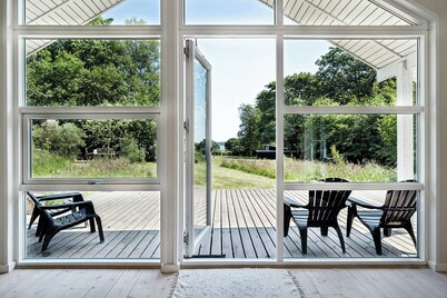 Forest house with stream by Hjarbæk Fjord