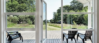 Forest house with stream by Hjarbæk Fjord