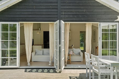 Outdoor dining. Wooden house with relaxing atmosphere