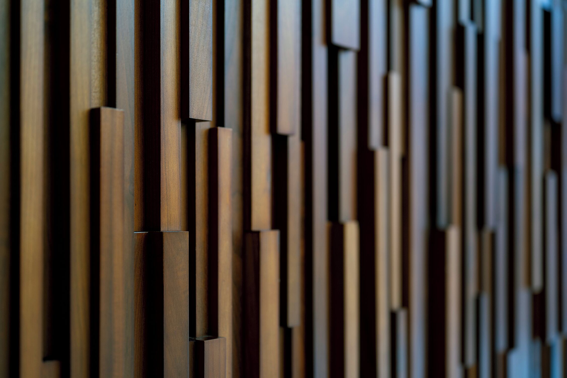 A close-up of a wooden wall with vertical planks.