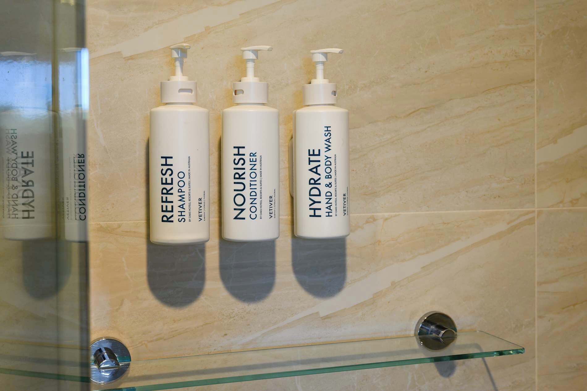 Shower, hair dryer, towels, shampoo