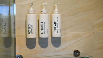 Shower, hair dryer, towels, shampoo