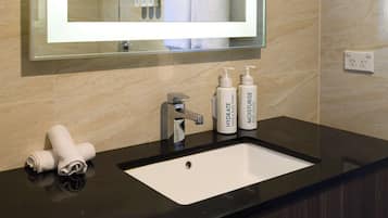 Shower, hair dryer, towels, shampoo