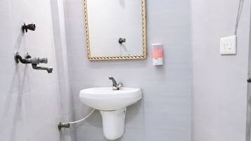 Shower, rainfall showerhead, slippers, towels