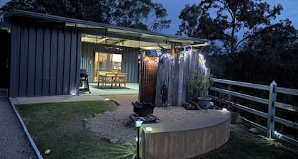 Hayden's Place is a cozy tiny off‑grid home offering stunning 180° views.