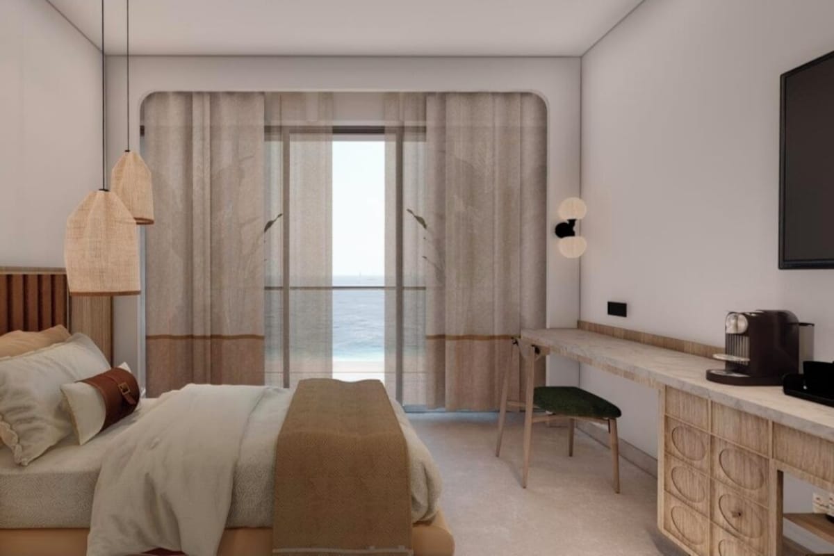 Suite Luxe, balcon, vue océan | Coffres-forts dans les chambres, bureau, rideaux occultants