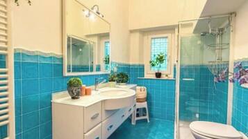 Apartment, Garden View (in Villa) | Bathroom | Shower, hair dryer, towels, soap