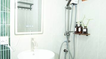 Shower, hair dryer, towels, soap
