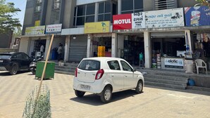 A multi-story building with signs for 'Hotel Swastik' and 'Hotel Royal Villa.'