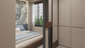 A bedroom with a bed, a window with curtains, a wall-mounted air conditioner, and a wardrobe.