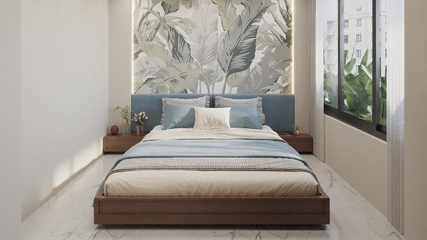 A modern bedroom with a large bed, a ceiling fan, and a view of buildings through a window.