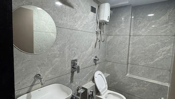 Deluxe Double Room, City View | Bathroom | Free toiletries, slippers, towels, soap
