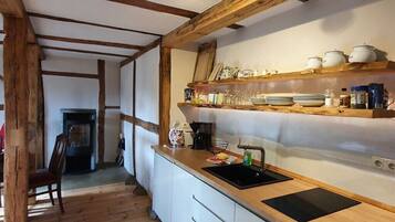 Fridge, stovetop, dishwasher, coffee/tea maker