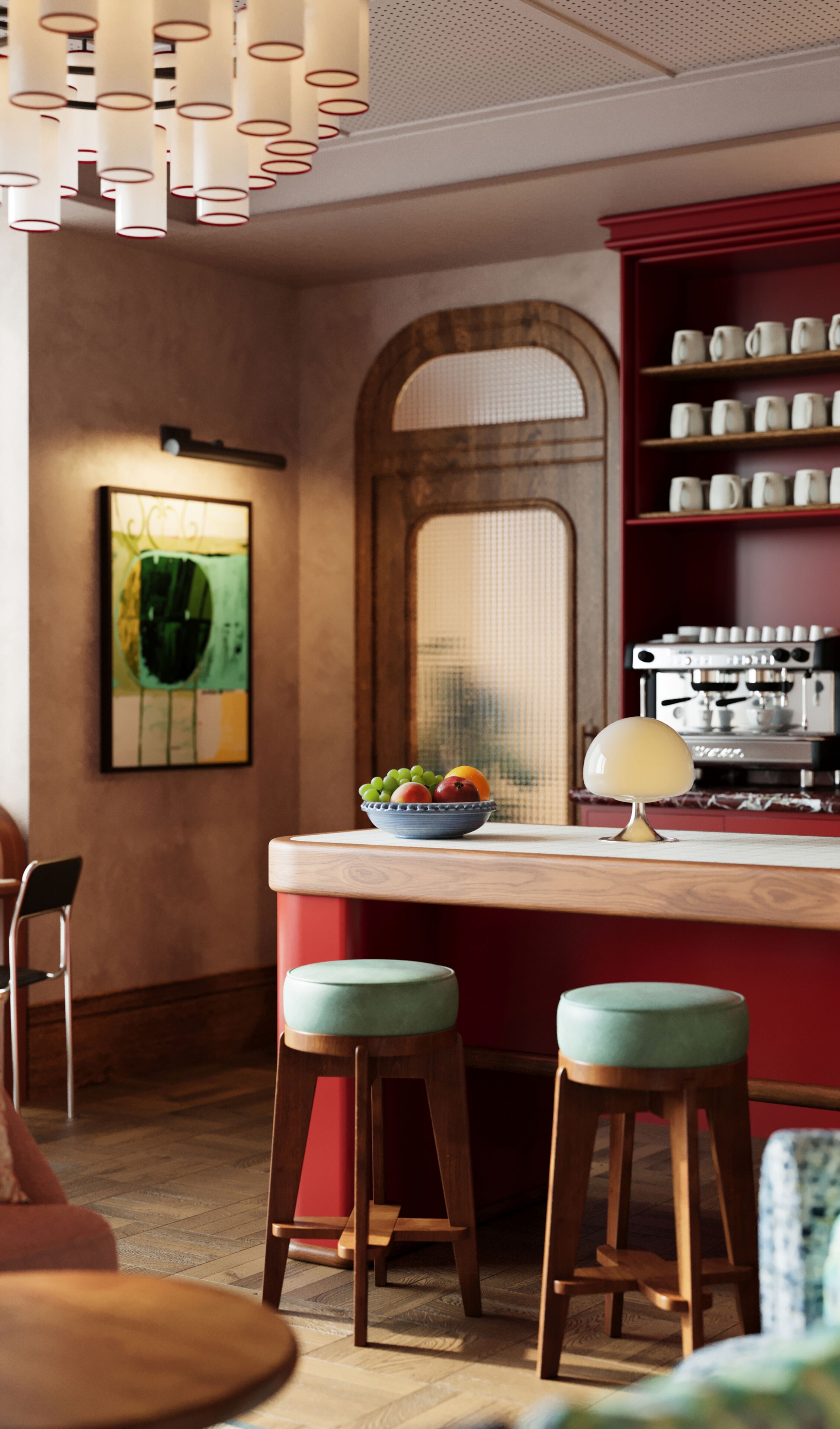 A kitchen with a bar area, stools, a coffee machine, and a fruit bowl.