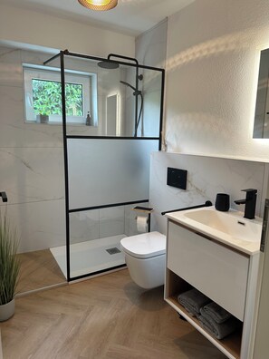 Shower, hair dryer, towels, soap