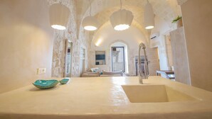 A bathroom with a large sink, two bowls, and a shower. - TD Terrazze di Carole Panoramic Terrace & Jacuzzi (Ostuni)
