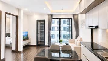 Appartement Luxe, balcon, vue ville | Coin séjour