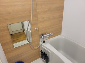 Twin Room | Bathroom | Combined shower/tub, hair dryer, slippers, towels - New Normal Hotel in NAHA WAKASA (Wakasa, Naha City)