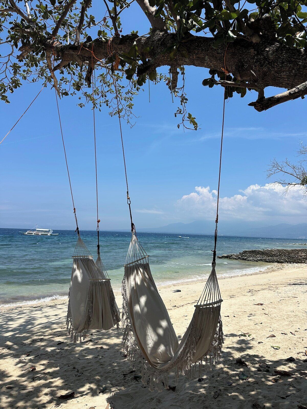 On the beach, white sand, sun-loungers, beach umbrellas