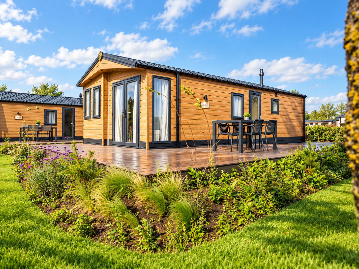 A modern wooden house with a deck, large windows, and a garden.
