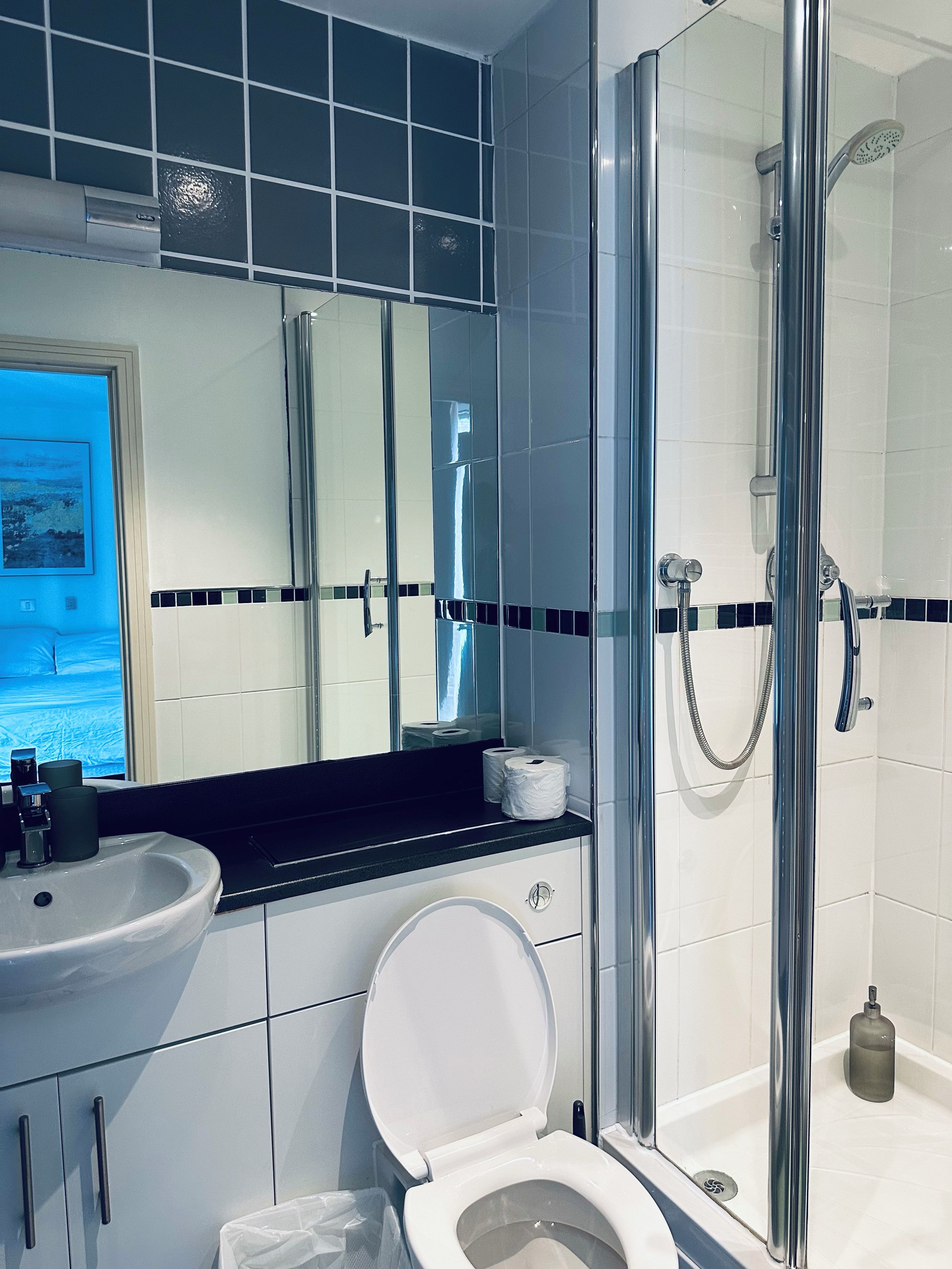 Combined shower/bathtub, deep-soaking bathtub, towels