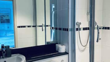 Combined shower/bathtub, deep-soaking bathtub, towels
