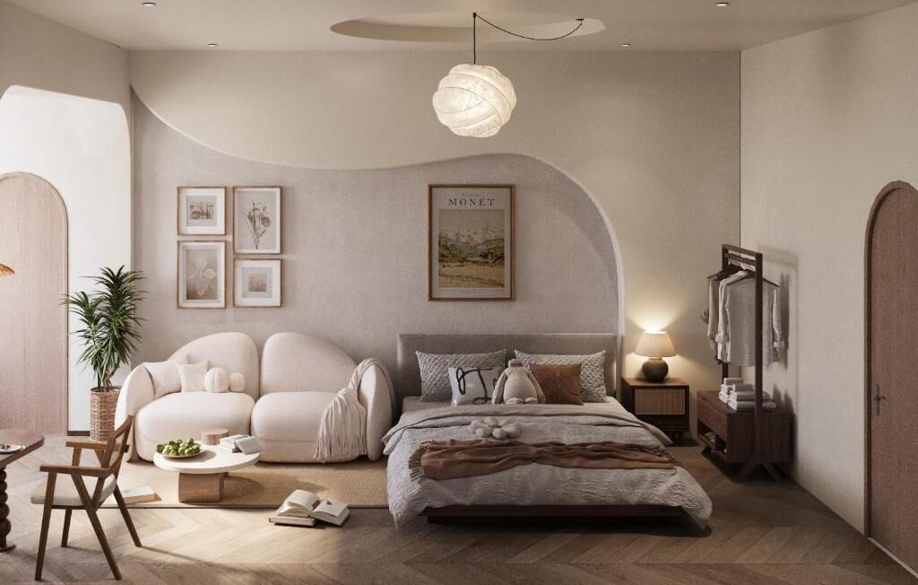 Una camera da letto moderna con un letto, un divano, un comodino, una lampada, una cornice e un armadio.