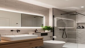 A modern bathroom with a freestanding bathtub, a large mirror, and a glass-enclosed shower. - Hotel with 5 bedrooms and AC in fantastic Lipa City (Lipa City)