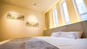 Premium bedding, down comforters, pillowtop beds, free minibar