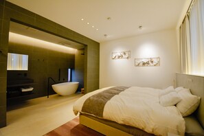 A modern bedroom with a large bed, a built-in bathtub, and a minimalist design. - yoichi-nap (Yoichi)