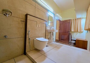 Family Room, 3 Twin Beds, Courtyard View | Bathroom | Slippers - Ushasree Wayanad Resort by VOYE HOMES (Sulthan Bathery)