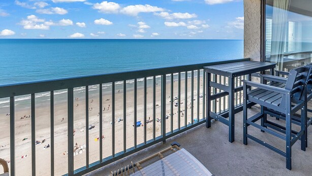 A balcony with a view of the beach and ocean. - Oceanfront l 16th Floor l 4BR l Pool and Lazy River (North Myrtle Beach)
