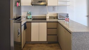 A modern kitchen with a stainless steel refrigerator, a microwave, and a toaster. - w Dreamy 2BR w Private Balcony in Cusco (Cusco)