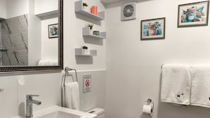 A modern bathroom with a sink, toilet, and towel rack. - w Dreamy 2BR w Private Balcony in Cusco (Cusco)