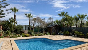 A rectangular swimming pool with a tiled edge, surrounded by a stone patio. - Can Romero - Whole house with private pool near Ibiza Town (Sant Josep de sa Talaia)