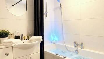 Jetted tub, hair dryer, towels, soap
