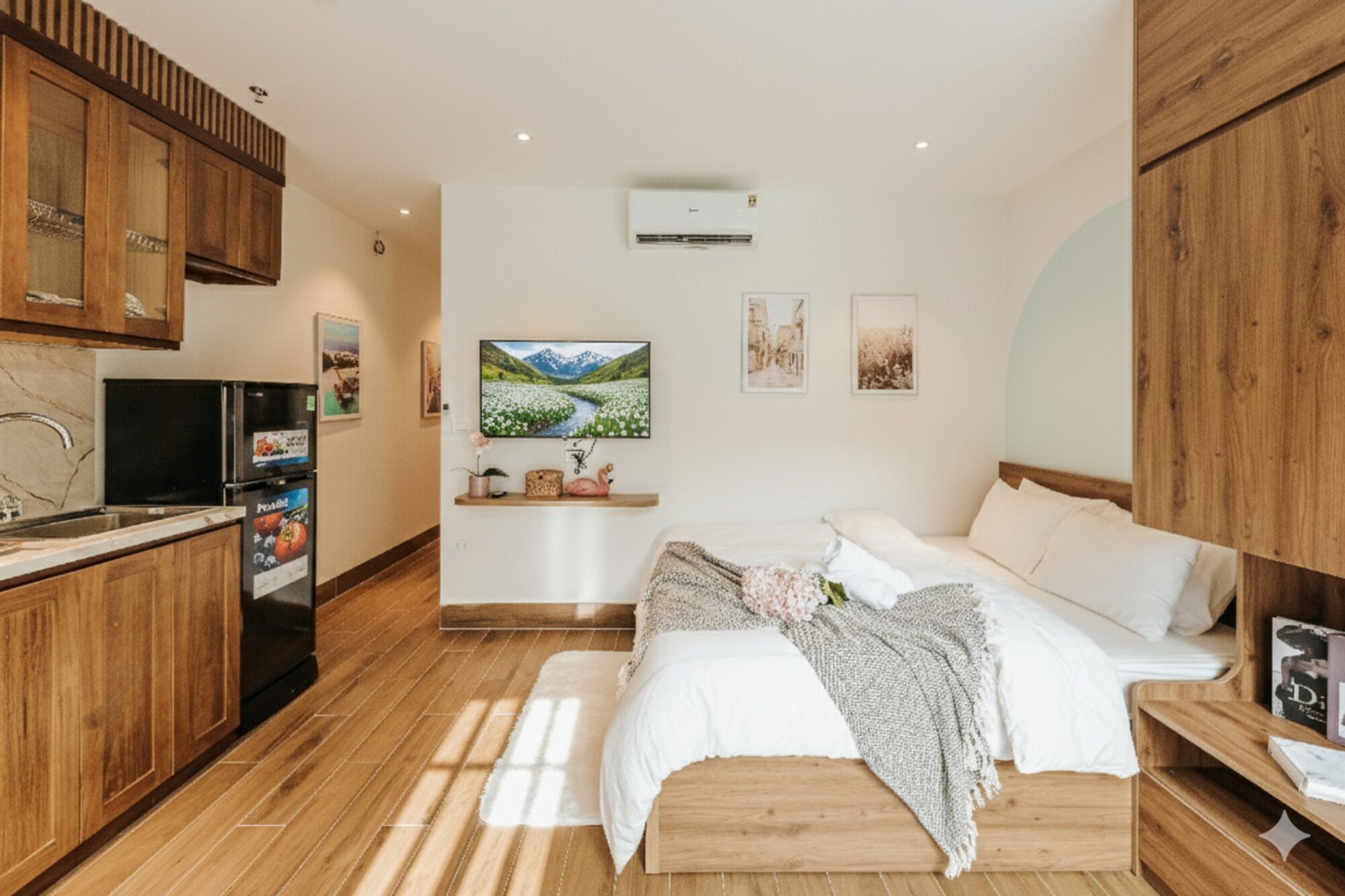 A modern bedroom with a wooden bed, a small bedside table, and a TV.