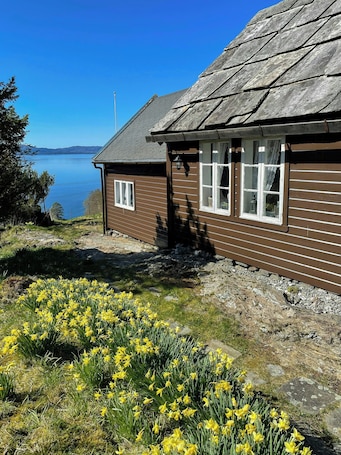 Property grounds. Historic farm with sea view over Bjørnefjorden