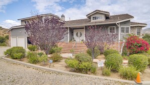 A two-story house with a front porch, a driveway, and a sign indicating a private road. - Amazing Mtn & City Views! Simi Valley Hideaway (Simi Valley)
