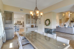 A spacious kitchen with a dining area, a chandelier, and a fireplace. - Amazing Mtn & City Views! Simi Valley Hideaway (Simi Valley)