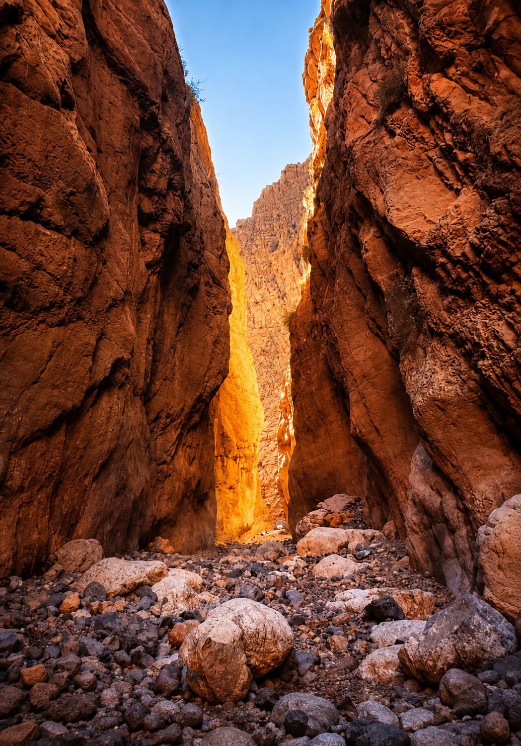 A canyon with rocky terrain and a narrow passageway.